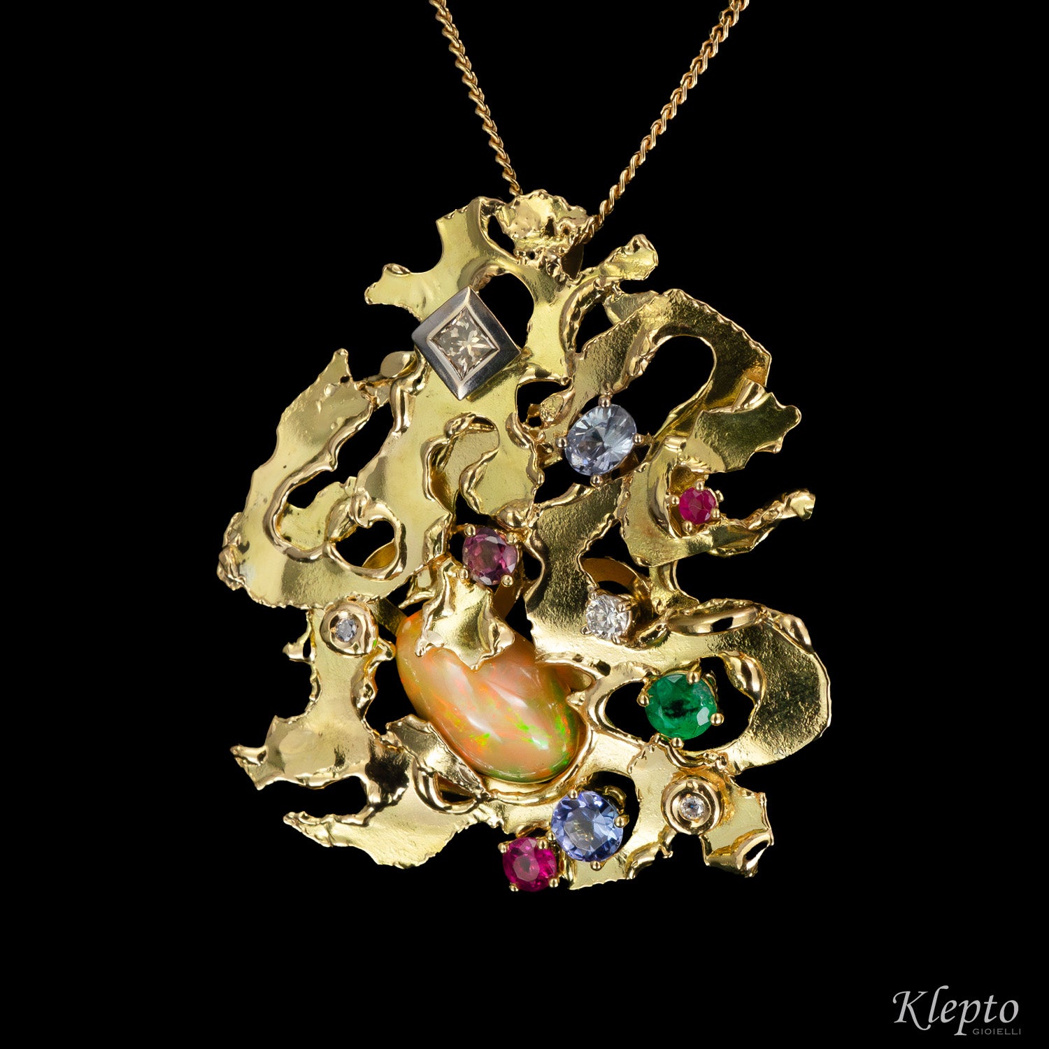 Pendente in oro scultura "Micromondo" con pietre preziose e tesoro nascosto