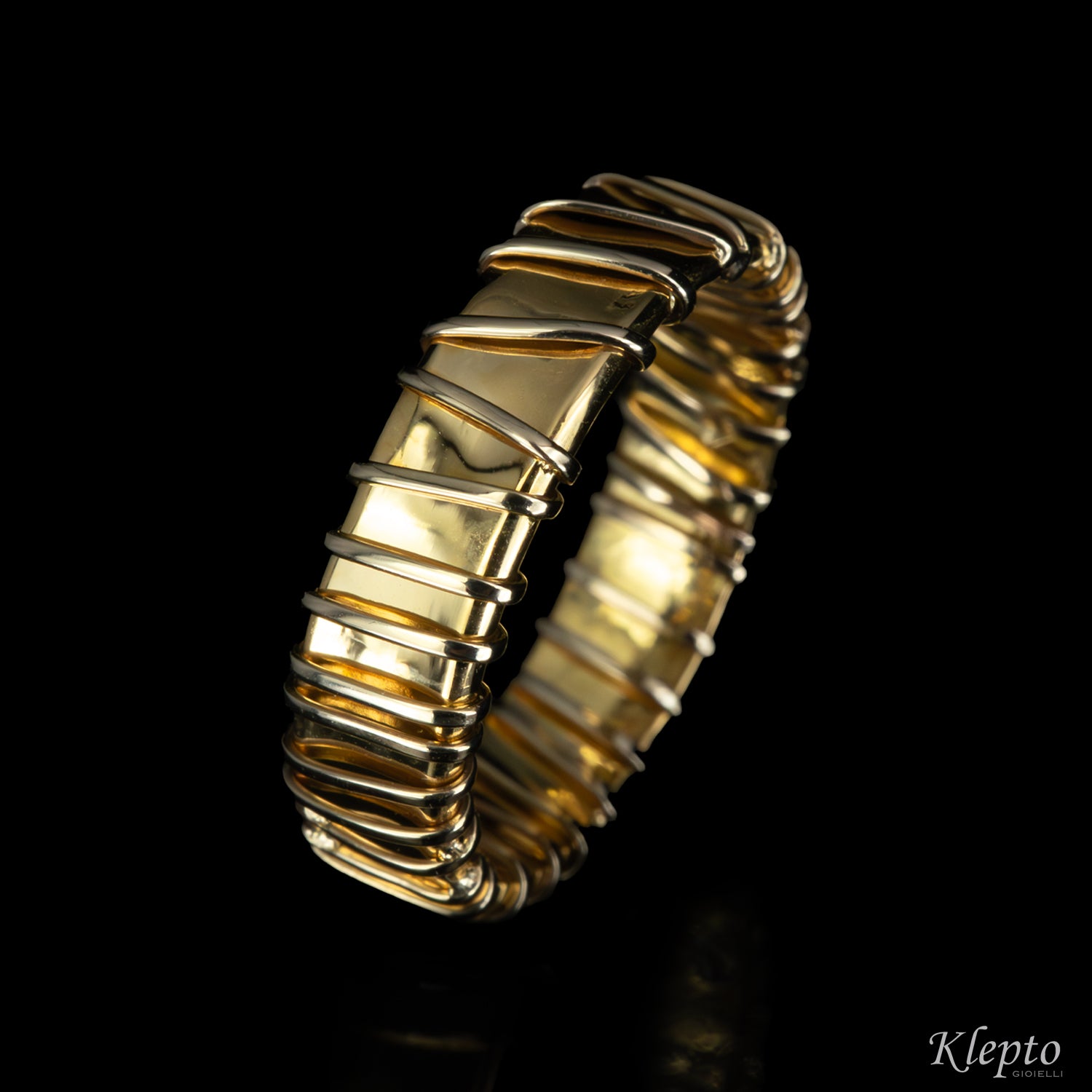 Anello in oro giallo e bianco naturale
